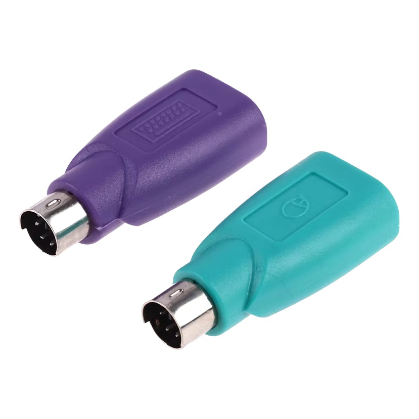 Adaptateur PS2 mâle vers prise USB femelle, violet ou vert Adaptateur PS2 mâle vers prise USB femelle, violet ou vert, vue de trois quarts