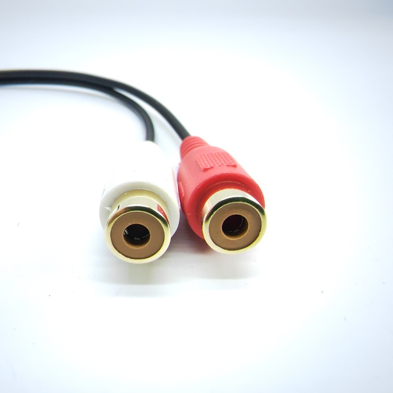 Adaptateur RCA vers jack, deux RCA femelles et prise 3,5 mm femelle Adaptateur RCA vers jack, deux RCA femelles et prise 3,5 mm femelle, vue arriere